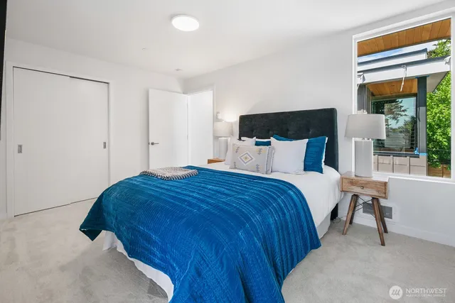 a bedroom with a bed and window