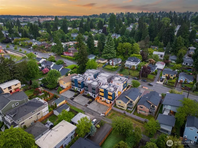 an aerial view of residential houses with outdoor space