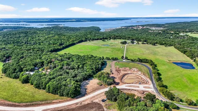 a view of a garden with a building in the background