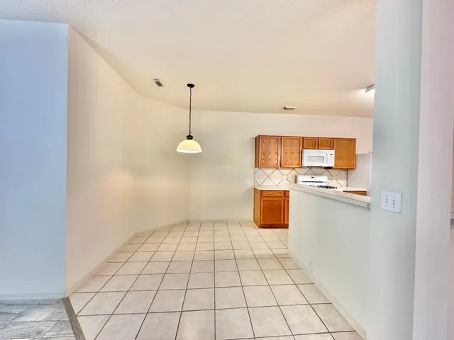a view of a kitchen with a sink