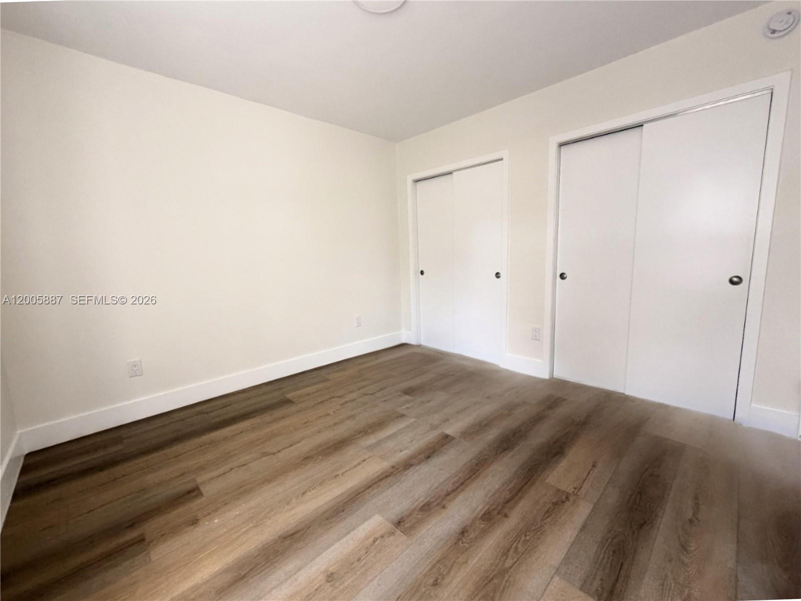 1904 Southwest 17th Avenue, Unit 8 Miami, FL 33145 - Photo 9 of 11 a view of empty room with wooden floor