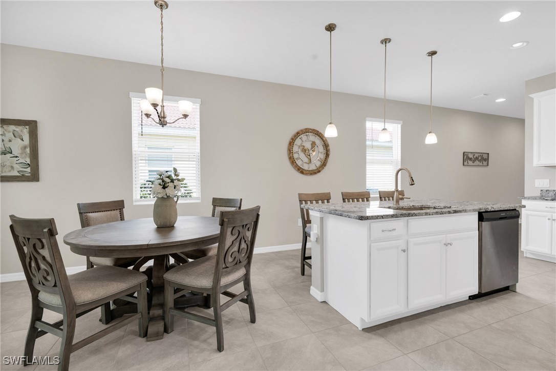 2125 Summersweet Drive Alva, FL 33920 - Photo 14 of 32 a view of a dining room and chandelier