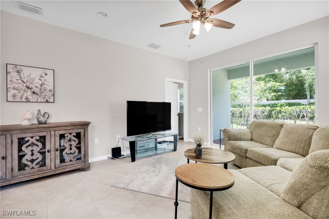 2125 Summersweet Drive Alva, FL 33920 - Photo 17 of 32 a living room with furniture and a flat screen tv