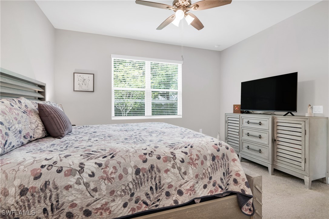 2125 Summersweet Drive Alva, FL 33920 - Photo 20 of 32 a bedroom with a bed and a flat screen tv