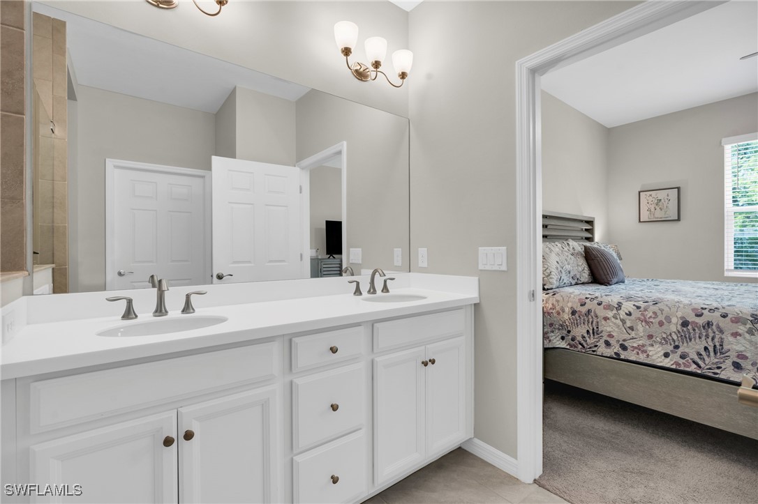 2125 Summersweet Drive Alva, FL 33920 - Photo 22 of 32 a bedroom with a double vanity sink and mirror