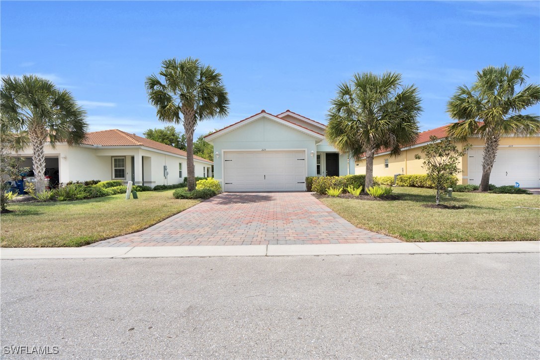 2125 Summersweet Drive Alva, FL 33920 - Photo 28 of 32 a front view of a house with a yard