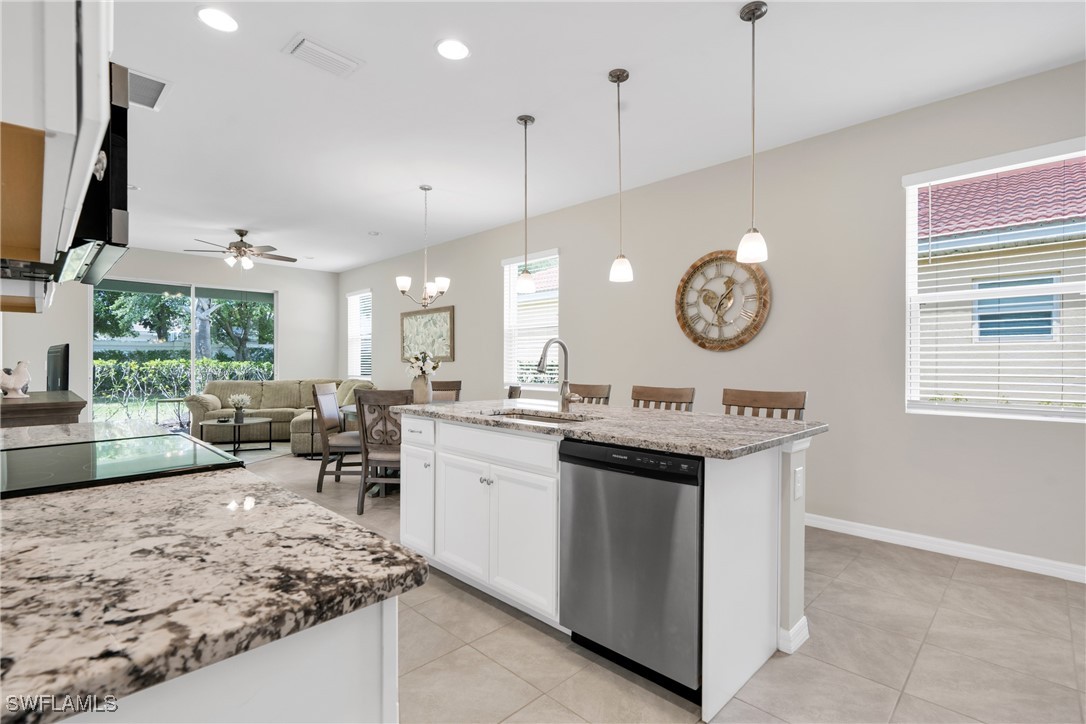 2125 Summersweet Drive Alva, FL 33920 - Photo 10 of 32 a kitchen with a sink cabinets and window