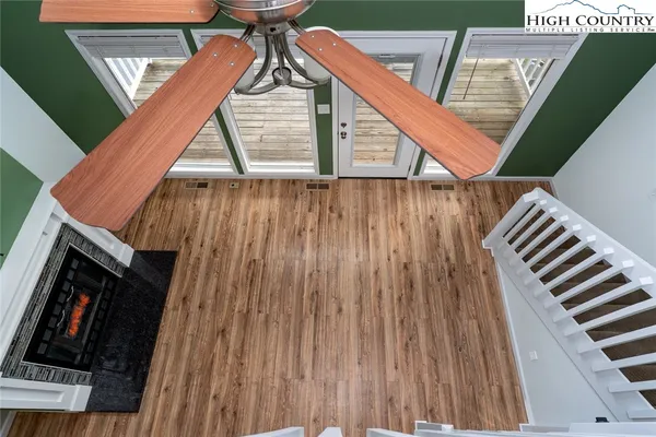 a view of deck with wooden floor and stairs