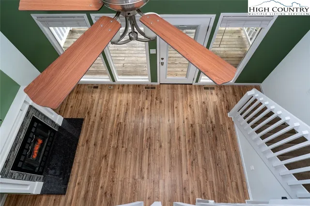 a view of deck with wooden floor and stairs