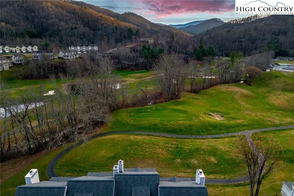 a view of a lake with a yard