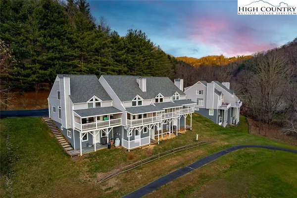 aerial view of a house with a big yard
