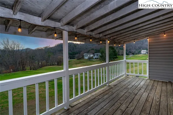 a view of a porch with wooden floor