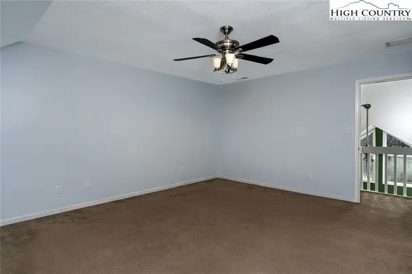 a view of a big room with carpet