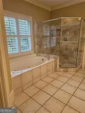 a bathroom with a shower and a bathtub