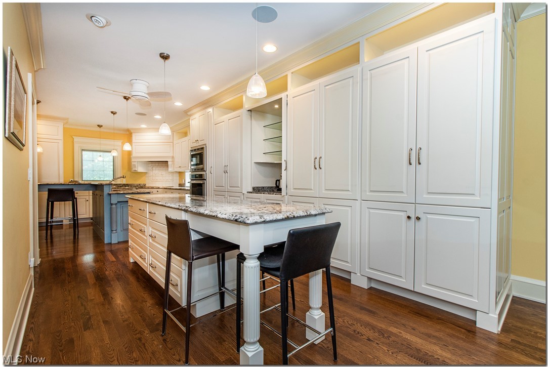 Amazing gourmet kitchen
 with custom cabinetry, granite counter tops, two islands, two sinks and Thermador 
appliances.