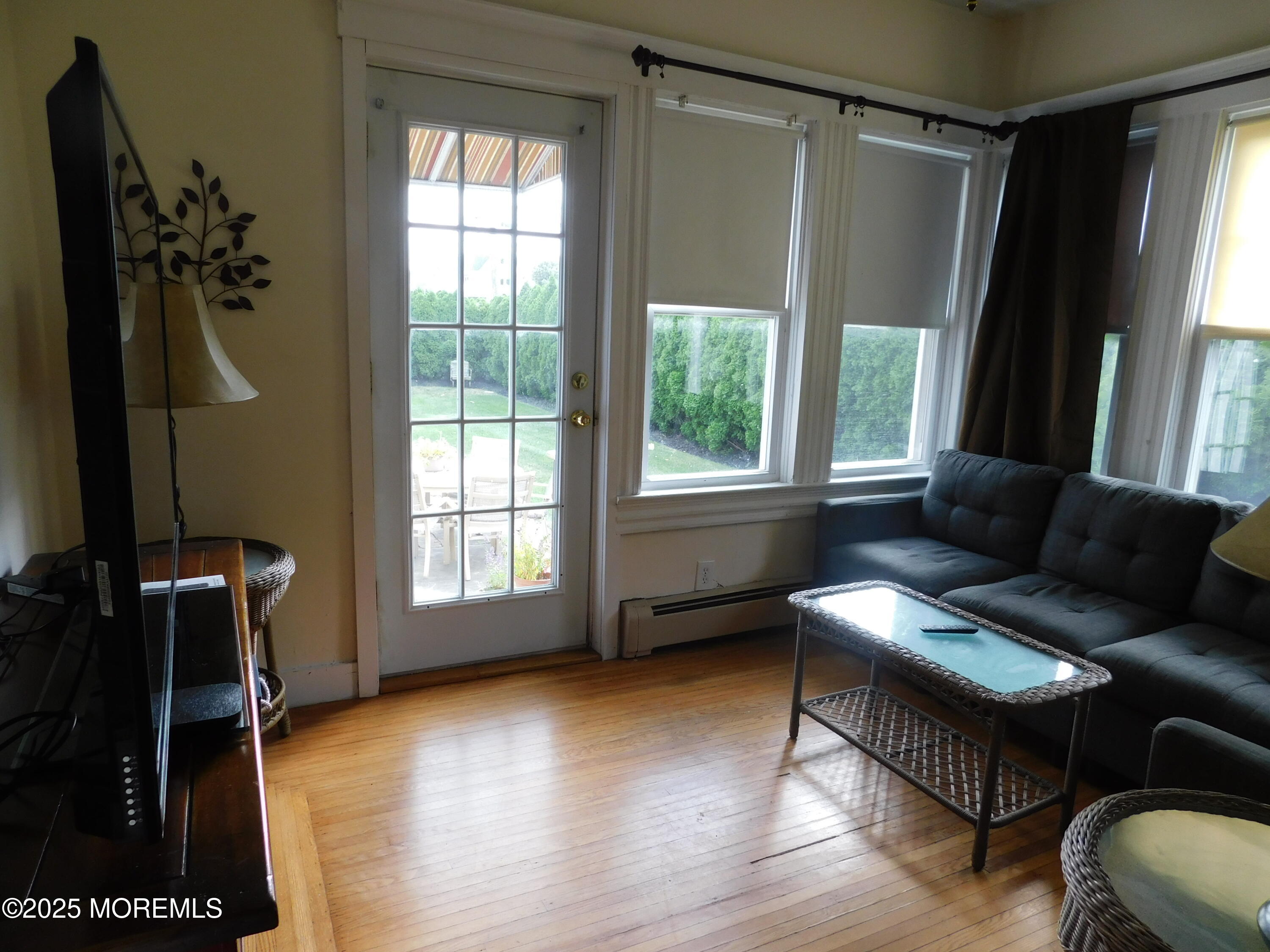 319 Jersey Avenue Spring Lake, NJ 07762 - Photo 14 of 21 a living room with furniture and a window