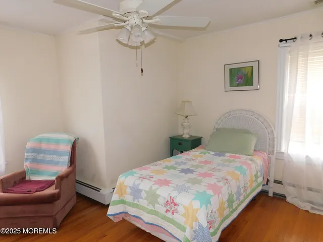 a bedroom with a bed and chair