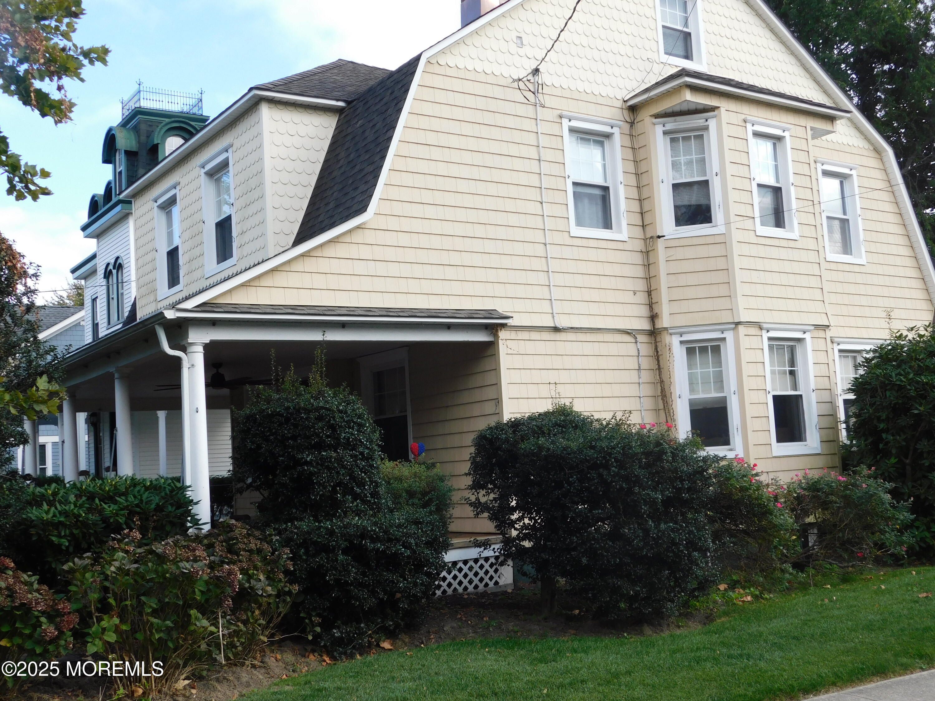 319 Jersey Avenue Spring Lake, NJ 07762 - Photo 20 of 21 a front view of a house with a garden