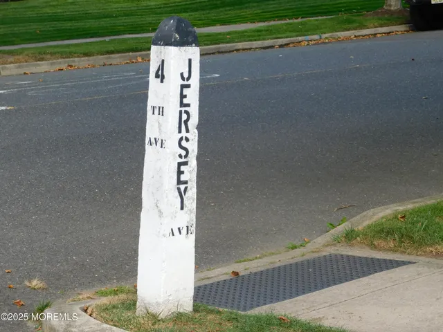 a sign board with a yard