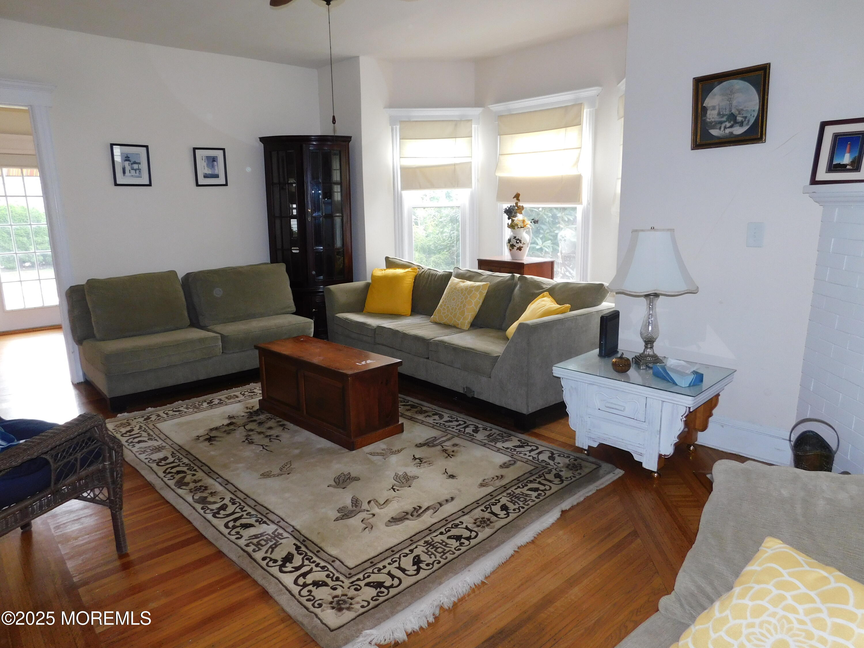 319 Jersey Avenue Spring Lake, NJ 07762 - Photo 6 of 21 a living room with furniture and a window
