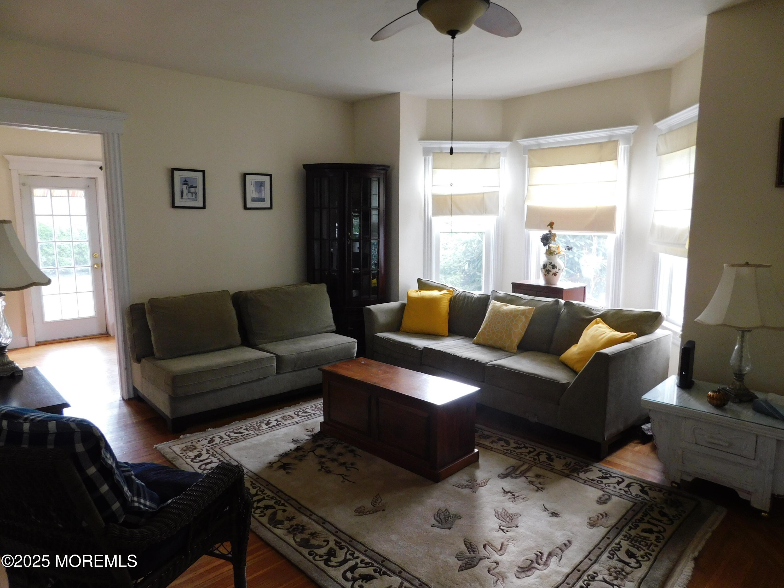 319 Jersey Avenue Spring Lake, NJ 07762 - Photo 8 of 21 a living room with furniture and a large window