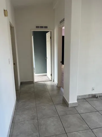 an empty room with a bathroom