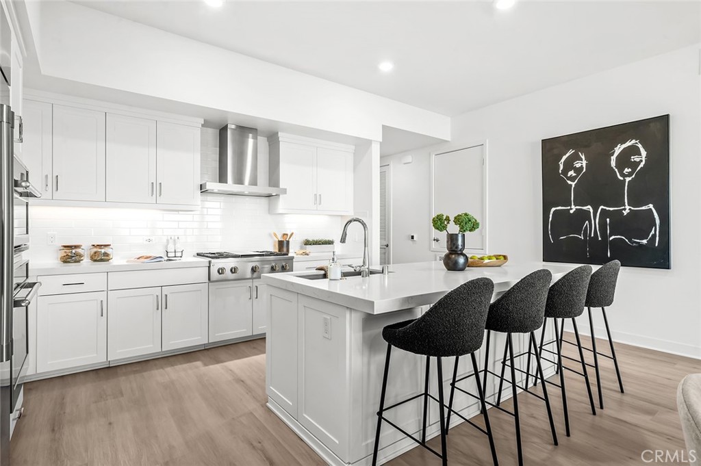 3604 Rivington Irvine, CA 92612 - Photo 12 of 54 a kitchen with a sink cabinets and window