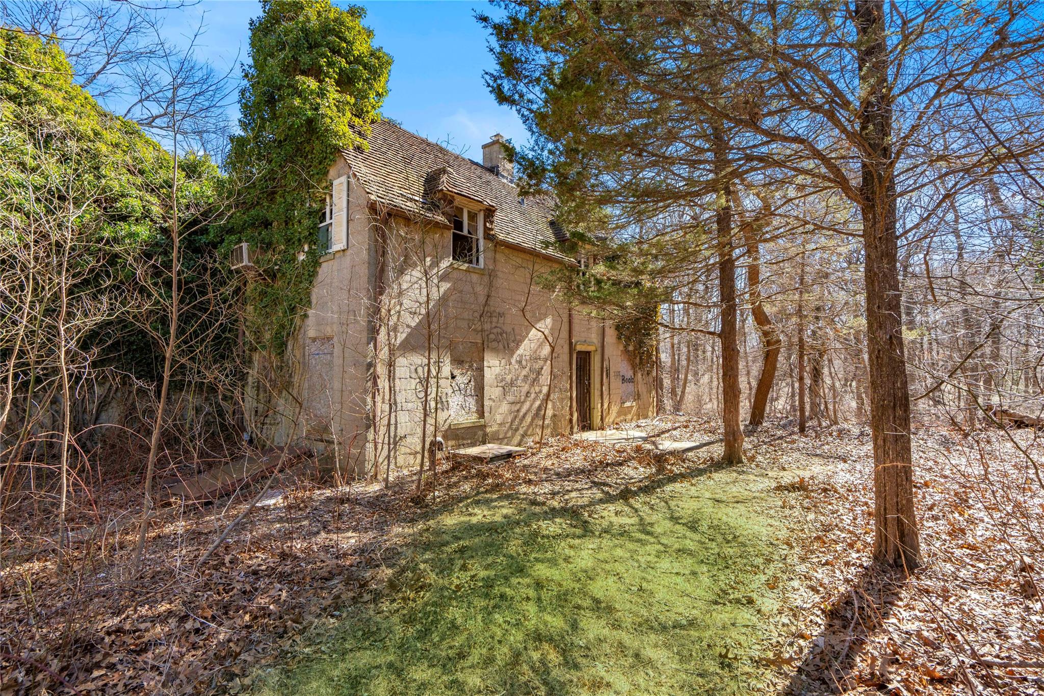 2340 Cedar Swamp Road Glen Head, NY 11545 - Photo 3 of 12 a view of a yard with large tree