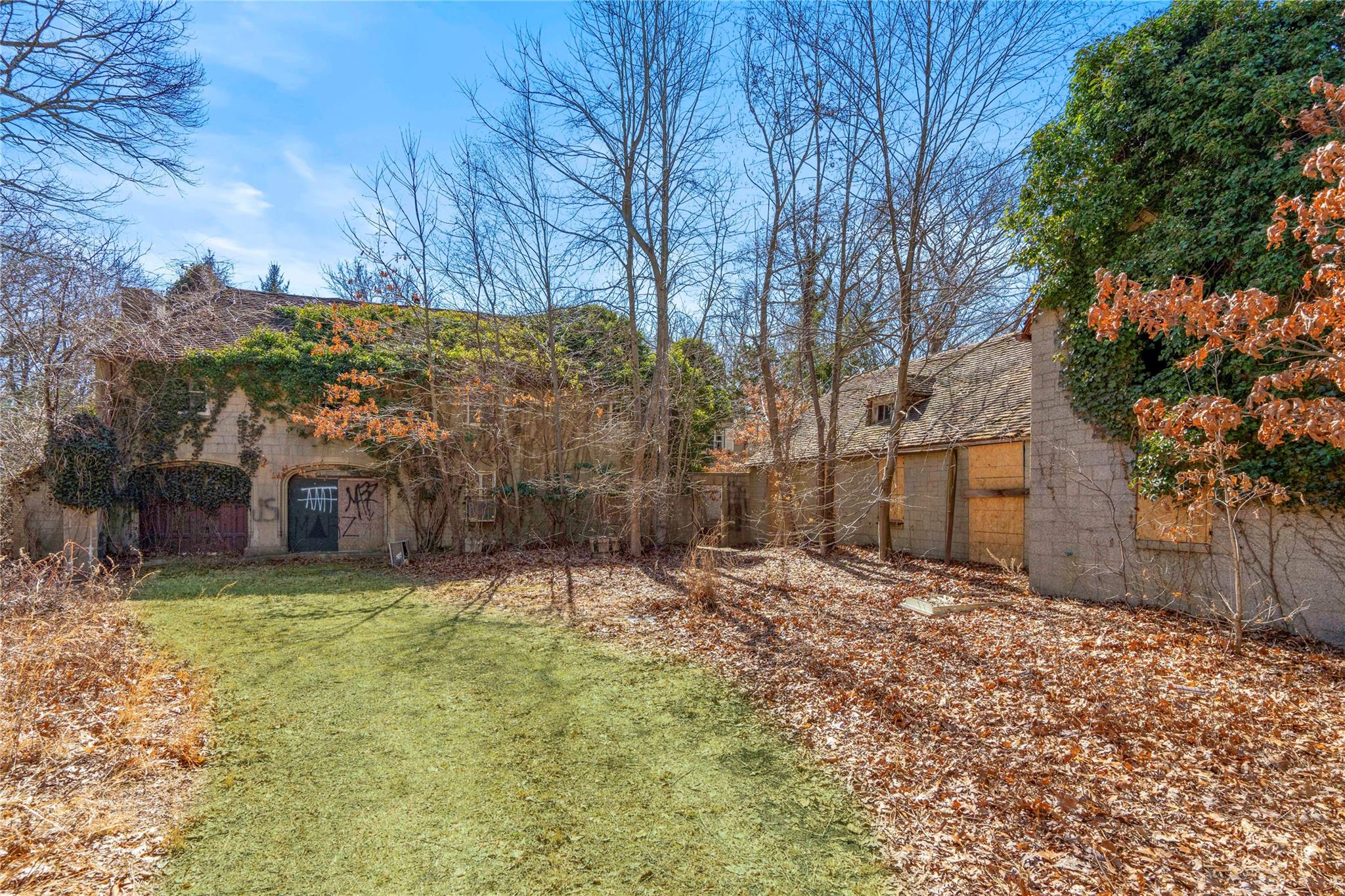 2340 Cedar Swamp Road Glen Head, NY 11545 - Photo 8 of 12 a view of a yard with a tree