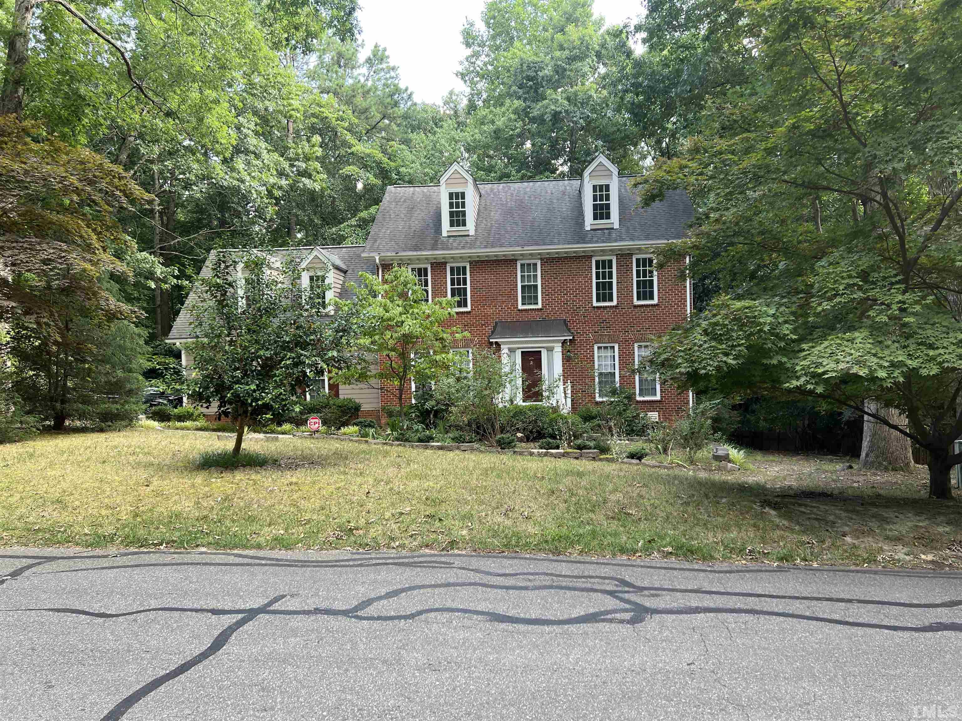12105 Warwickshire Way Raleigh, NC 27613 - Photo 1 of 44 a front view of a house with a yard