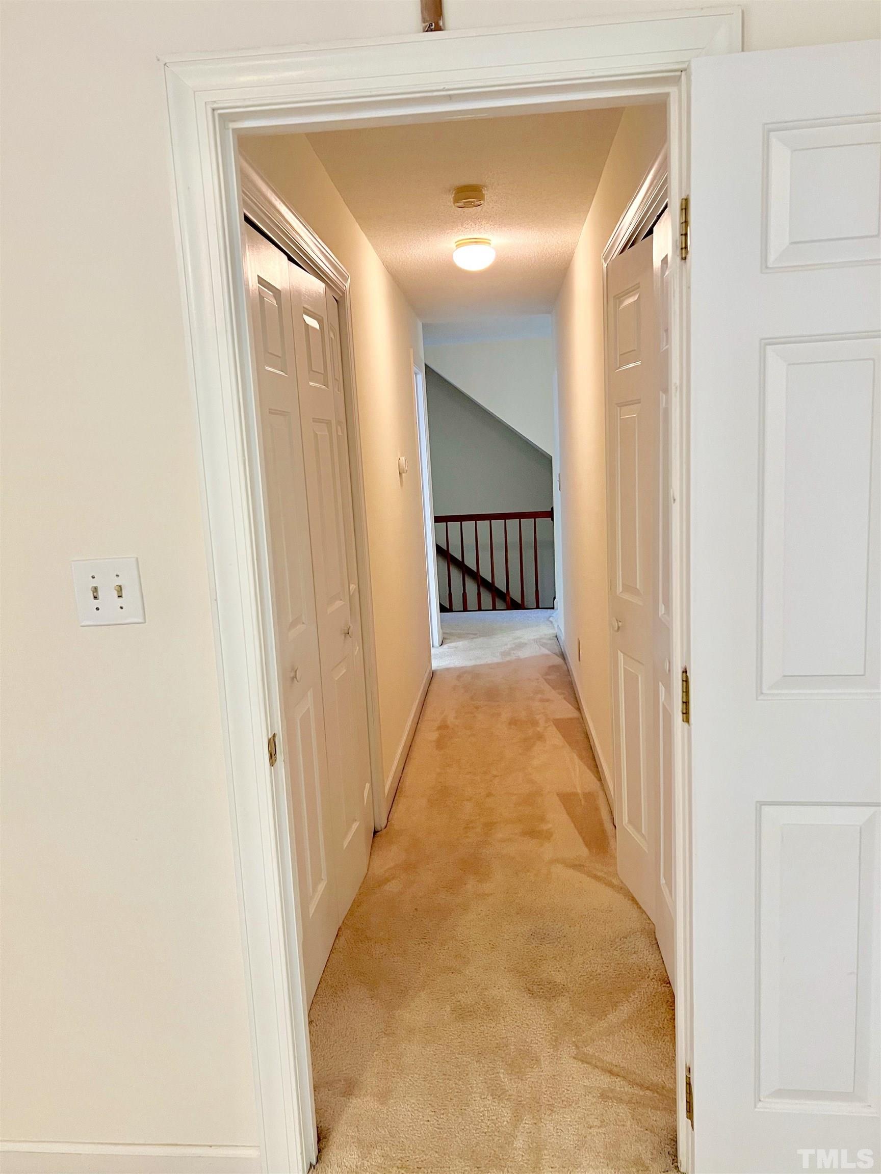 12105 Warwickshire Way Raleigh, NC 27613 - Photo 41 of 44 a view of a hallway with a dining room