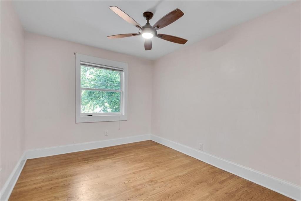 351 Cherokee Avenue Southeast, Unit 8 Atlanta, GA 30312 - Photo 21 of 28 an empty room with a window and a ceiling fan