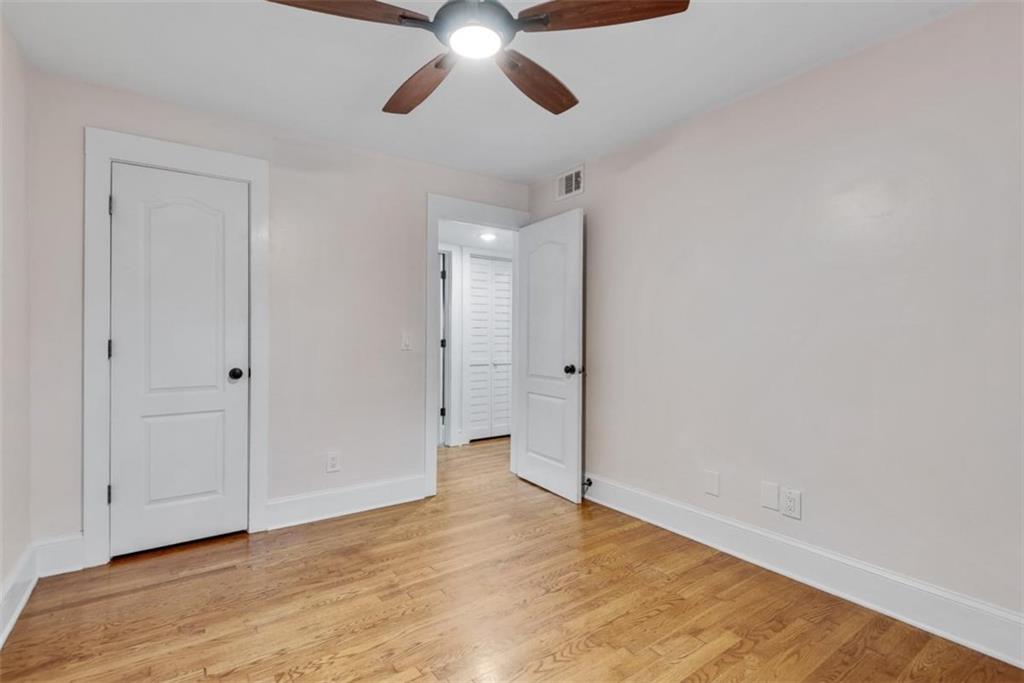 351 Cherokee Avenue Southeast, Unit 8 Atlanta, GA 30312 - Photo 22 of 28 a view of an empty room and wooden floor
