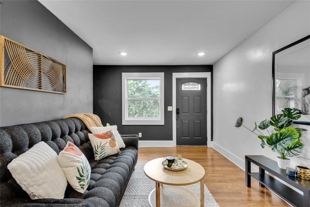 351 Cherokee Avenue Southeast, Unit 8 Atlanta, GA 30312 - Photo 7 of 28 a living room with furniture and a potted plant