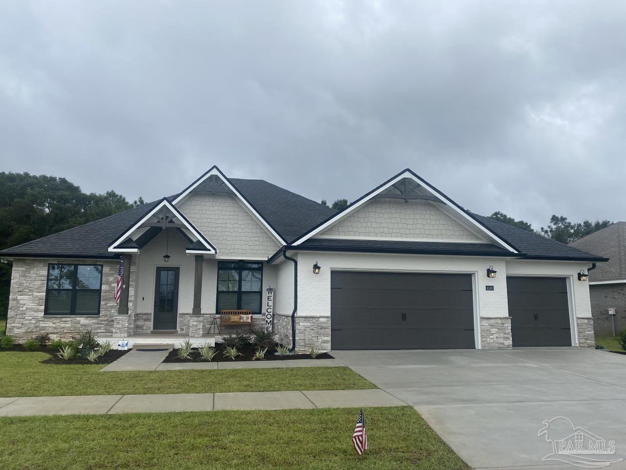 front view of a house with a yard