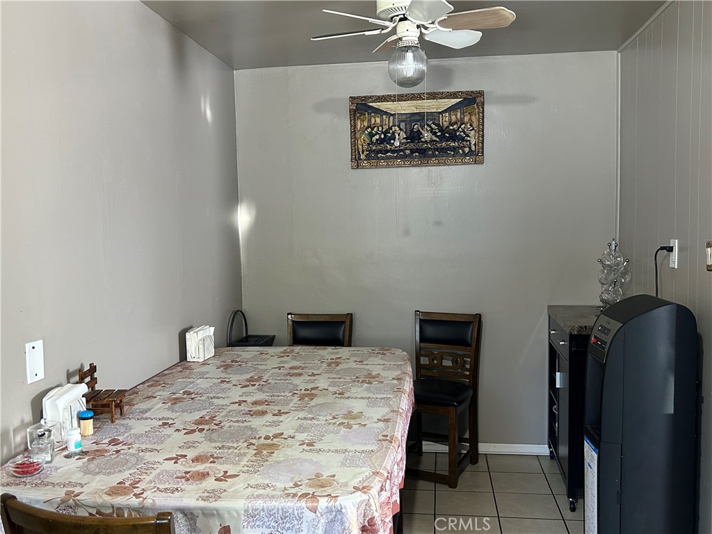 2011 East Elizabeth Street Compton, CA 90221 - Photo 11 of 19 a bedroom with a bed and a chandelier