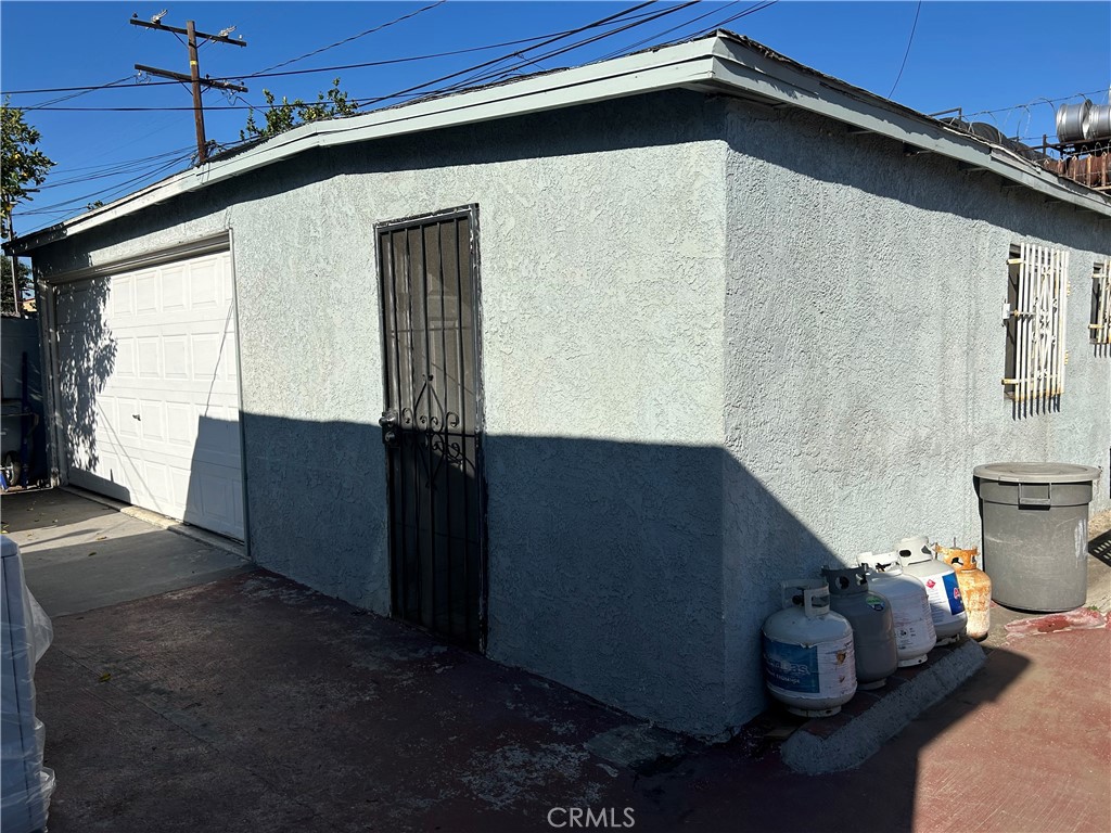 2011 East Elizabeth Street Compton, CA 90221 - Photo 19 of 19 a backyard of a house with wooden fence and barbeque oven
