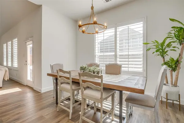 a bedroom with furniture and a flat screen tv