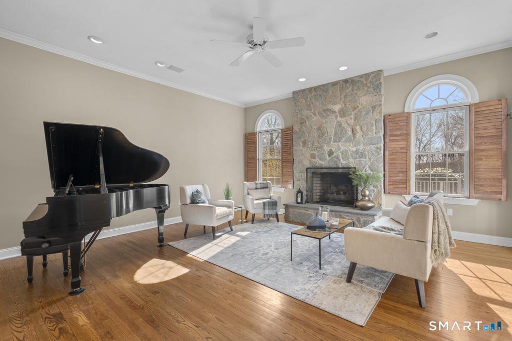 14 Cleft Rock Road Woodbridge, CT 06525 - Photo 11 of 40 Family room with fireplace