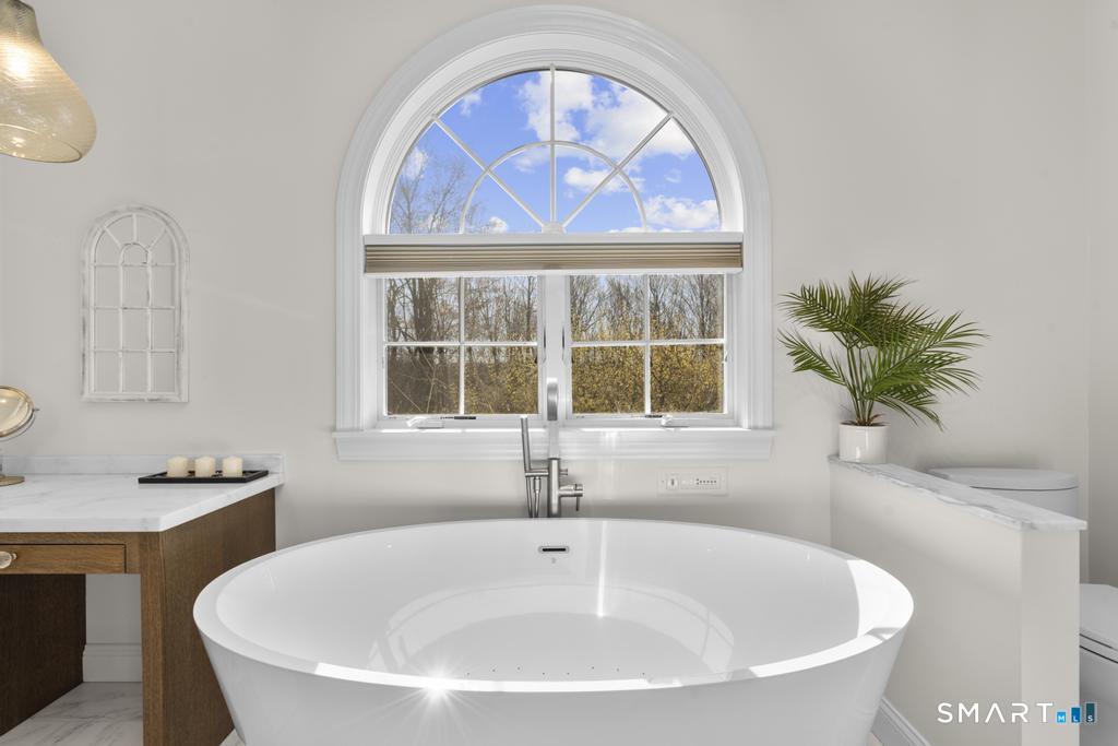 14 Cleft Rock Road Woodbridge, CT 06525 - Photo 19 of 40 soaking tub in primary bedroom bathroom