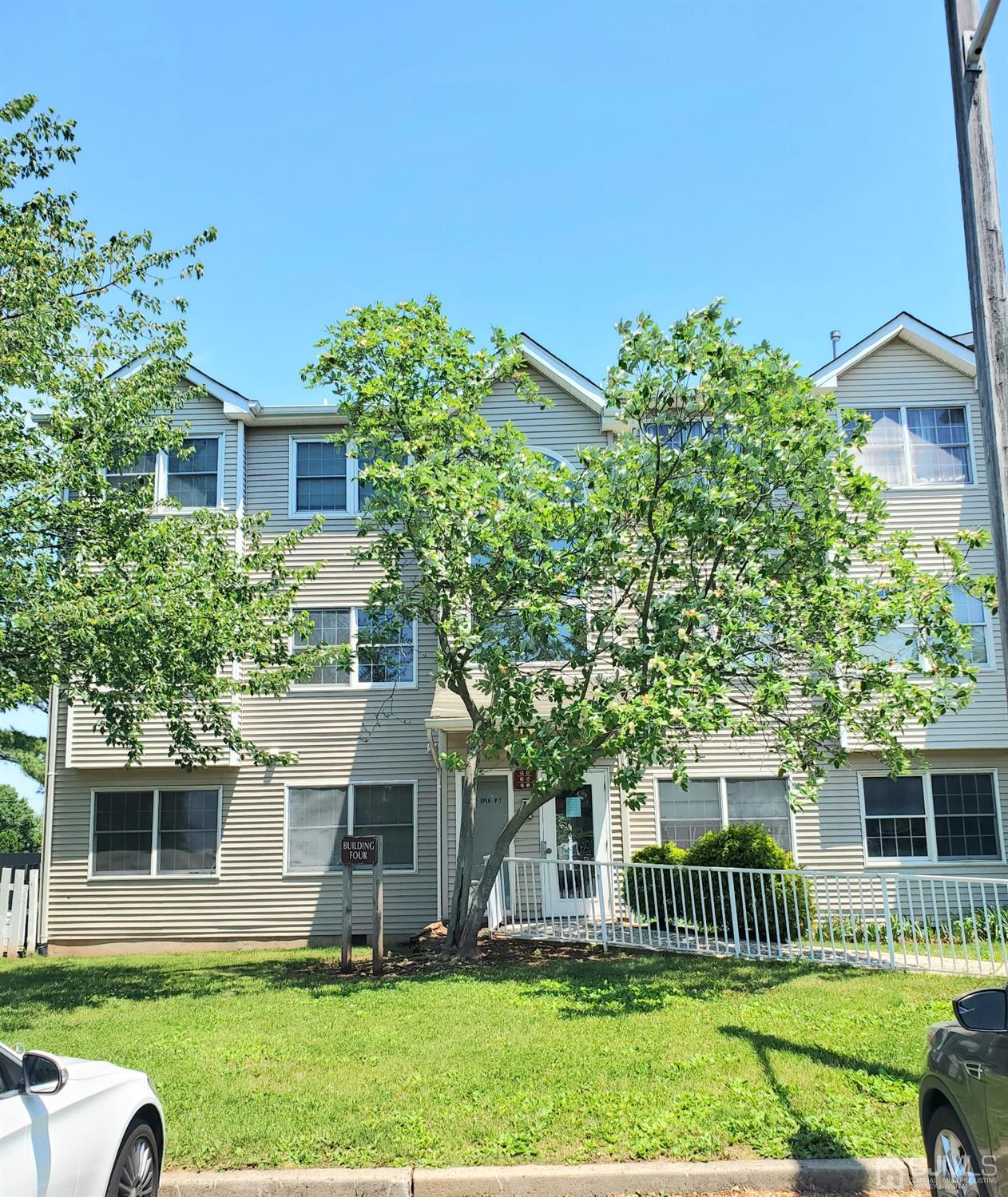427 Edpas Road New Brunswick, NJ 08901 - Photo 2 of 11 a front view of a house with a garden