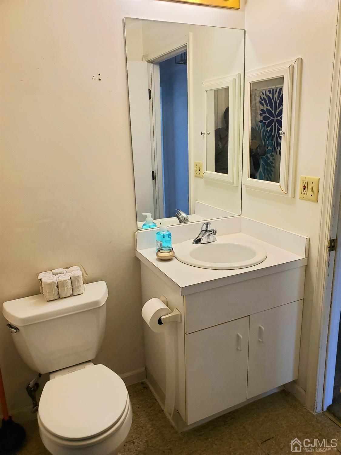 427 Edpas Road New Brunswick, NJ 08901 - Photo 9 of 11 a bathroom with a toilet sink and mirror