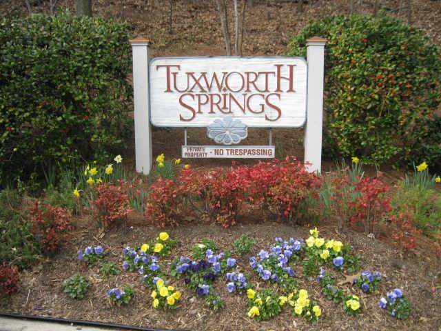 1205 McClelen Way, Unit 1205 Decatur, GA 30033 - Photo 1 of 1 a sign that is in front of flowers