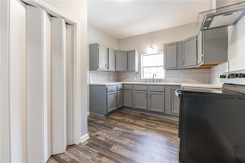 1002 South 2nd Street Temple, TX 76504 - Photo 10 of 10 a kitchen with a sink cabinets and window