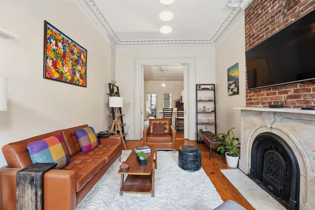 a living room with furniture or couch and a flat screen tv