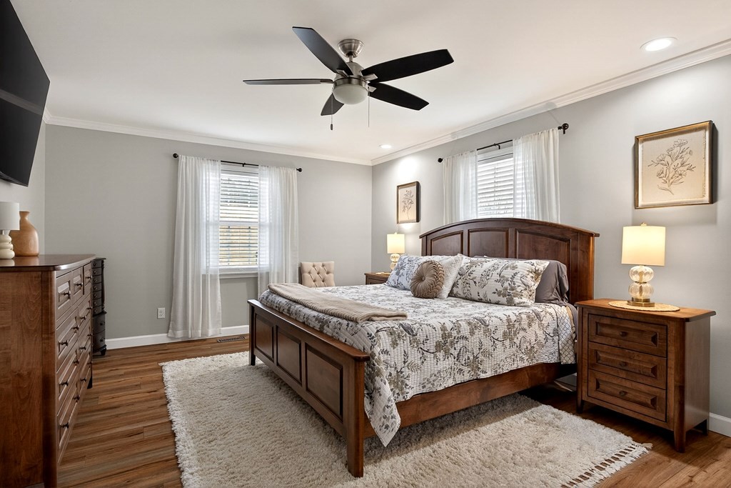 2195 Windle Community Road Cookeville, TN 38506 - Photo 11 of 22 a bedroom with a bed and a ceiling fan