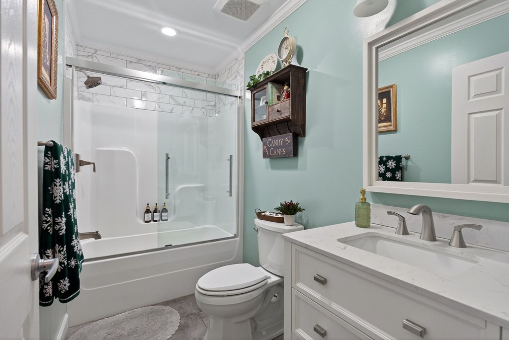 2195 Windle Community Road Cookeville, TN 38506 - Photo 17 of 22 a bathroom with a granite countertop sink toilet and shower