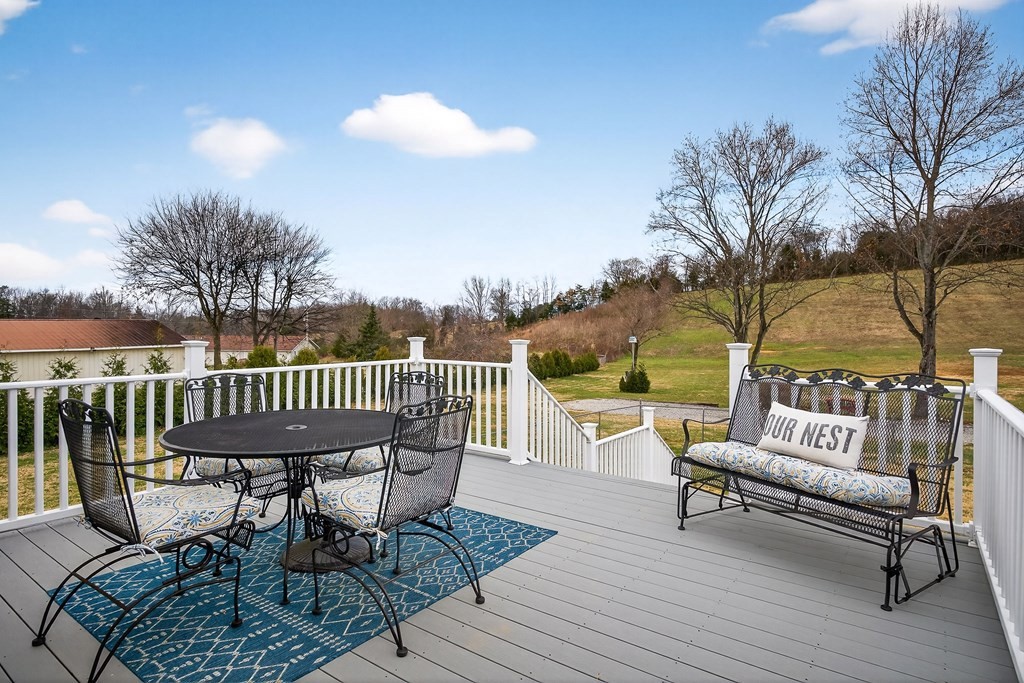 2195 Windle Community Road Cookeville, TN 38506 - Photo 21 of 22 a view of a chairs on the deck in front of house