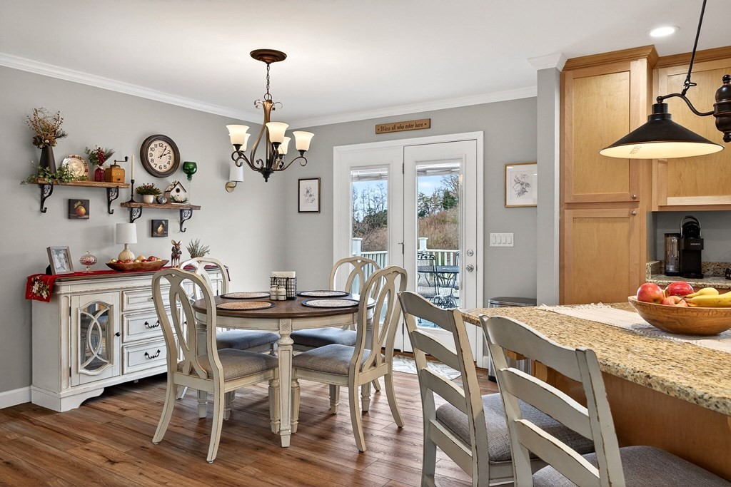 2195 Windle Community Road Cookeville, TN 38506 - Photo 7 of 22 a view of a dining room with furniture a chandelier and wooden floor