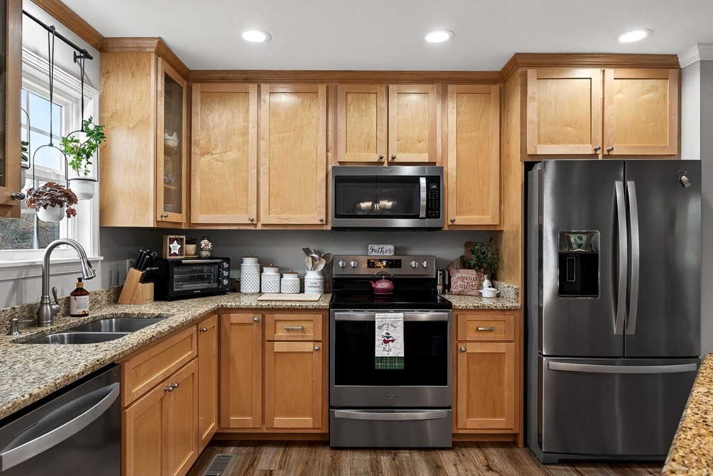 2195 Windle Community Road Cookeville, TN 38506 - Photo 9 of 22 a kitchen with stainless steel appliances granite countertop a refrigerator stove and microwave